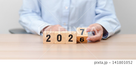 2026 change to 2027 year block on table. goal, Resolution, strategy, plan, start, budget, mission, action, motivation and New Year concepts 2026 change to 2027 year block on table. goal, Resolution, strategy, plan, start, budget, mission, action, motivation and New Year concepts 141801052