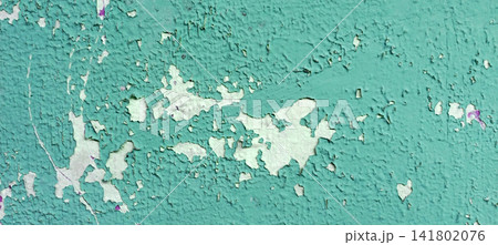 Peeling turquoise paint on a weathered wall texture Peeling turquoise paint on a weathered wall texture 141802076