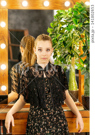Teen Girl Showing Finished Beauty Look Before Salon Mirror Teen Girl Showing Finished Beauty Look Before Salon Mirror 141802653