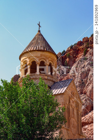 Noravank church with conical roof and cross atop Noravank church with conical roof and cross atop 141802969