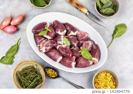 Uncooked turkey hearts with herbs Uncooked turkey hearts with herbs 141804770
