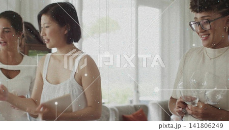 Talking three women holding tablet and checking smartphone in living room at home, with eyeglasses Talking three women holding tablet and checking smartphone in living room at home, with eyeglasses 141806249