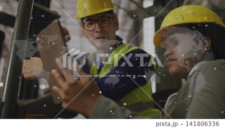 Discussing Asian man and woman reviewing tablets in site, yellow hard hats hi-vis vest data overlay 141806336