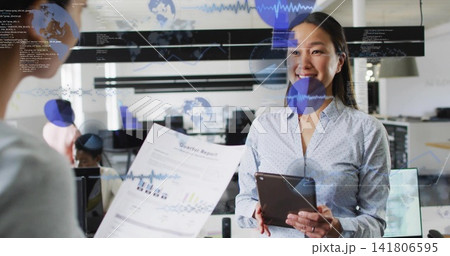 Holding tablet and smiling Korean woman in top reading glass overlay in office with Quarter Report Holding tablet and smiling Korean woman in top reading glass overlay in office with Quarter Report 141806595