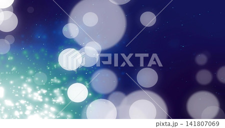 Glowing overlapping soft circular bokeh discs forming gradient backdrop with white teal sparkles Glowing overlapping soft circular bokeh discs forming gradient backdrop with white teal sparkles 141807069