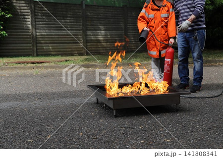 fire prevention. corporate safety - exercise during a firefighting course 141808341