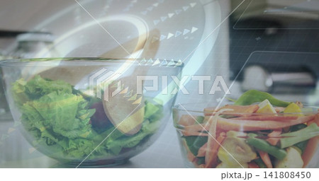 Showing large glass bowl holding lettuce and wooden spoon on kitchen countertop, with AR overlay Showing large glass bowl holding lettuce and wooden spoon on kitchen countertop, with AR overlay 141808450