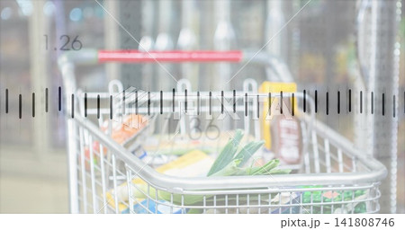 Showing chrome cart holding leafy greens, boxed goods, yellow-capped bottle, ruler overlay in store Showing chrome cart holding leafy greens, boxed goods, yellow-capped bottle, ruler overlay in store 141808746