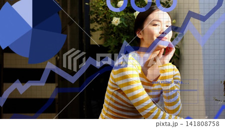 Smiling Asian woman resting chin on hand on balcony striped top rose-bush, data overlay, copy space 141808758