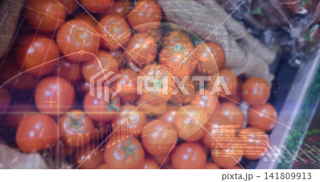 Displaying ripe red tomatoes with green stems in crate at market stall, with digital HUD overlay Displaying ripe red tomatoes with green stems in crate at market stall, with digital HUD overlay 141809913