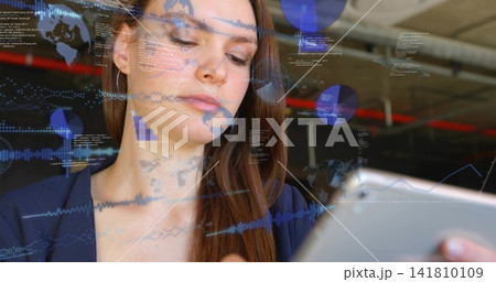 Analyzing woman in navy blazer interacting with tablet at open office with AR overlays red pipe 141810109