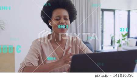 Talking woman wearing light blouse gesturing toward laptop in home with wired earbuds overlays Talking woman wearing light blouse gesturing toward laptop in home with wired earbuds overlays 141810350