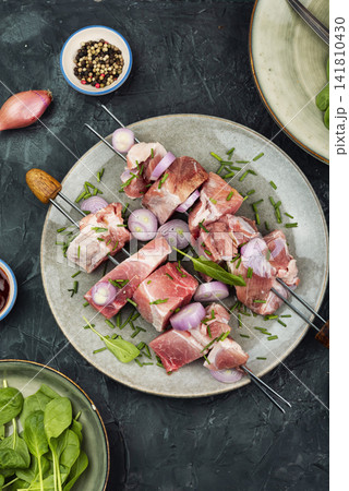 Fresh pork meat skewers ready for BBQ cooking Fresh pork meat skewers ready for BBQ cooking 141810430