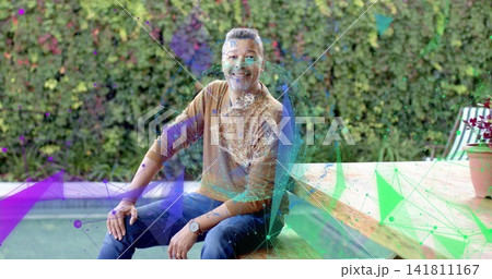 Sitting man wearing brown pullover and blue jeans on wooden bench by pool, with holographic overlay Sitting man wearing brown pullover and blue jeans on wooden bench by pool, with holographic overlay 141811167