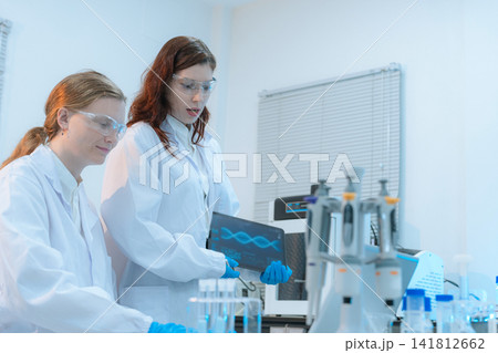 Scientist researching plant extracts for antiviral and virus prevention. 141812662