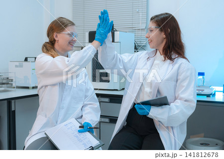 Scientist researching plant extracts for antiviral and virus prevention. Scientist researching plant extracts for antiviral and virus prevention. 141812678