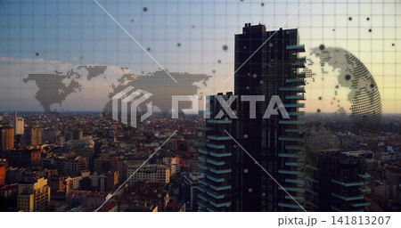 Framing dark skyscraper cluster right of center from high vantage, with map overlay, copy space 141813207