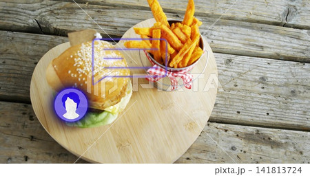 Showing flag-topped burger and fries on heart bamboo board with purple AR overlay on picnic table Showing flag-topped burger and fries on heart bamboo board with purple AR overlay on picnic table 141813724