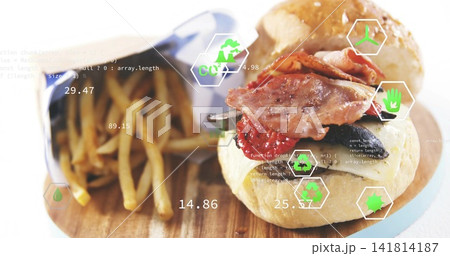 Showing bacon-topped burger sitting right on wood board, with fry cone, blue paper, green UI Showing bacon-topped burger sitting right on wood board, with fry cone, blue paper, green UI 141814187