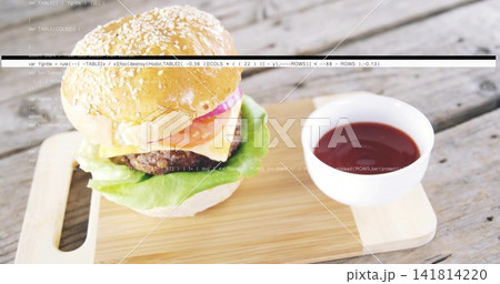 Sesame burger sitting on cutting board on rustic plank table, with ketchup bowl, cheese, code lines Sesame burger sitting on cutting board on rustic plank table, with ketchup bowl, cheese, code lines 141814220