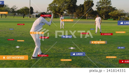 Holding left batter adjusting bat grip at park field, wearing white kits, showing social badges Holding left batter adjusting bat grip at park field, wearing white kits, showing social badges 141814331