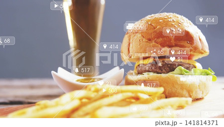 Showing cheeseburger on board with fries, dipping bowl, drink, notification overlays, copy space Showing cheeseburger on board with fries, dipping bowl, drink, notification overlays, copy space 141814371