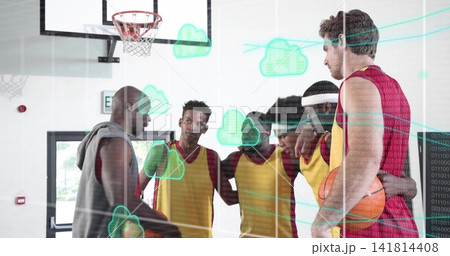 Coaching coach directing team on gym court in yellow jerseys, holding ball, hoop, cloud overlay 141814408