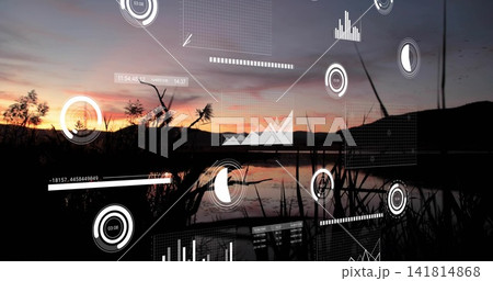 Reflecting sunset lake with dark reeds centering shoreline, displaying translucent AR data overlays Reflecting sunset lake with dark reeds centering shoreline, displaying translucent AR data overlays 141814868