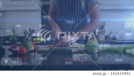 Chopping man wearing striped apron cutting produce at kitchen counter, chef's knife overlay icons 141814901