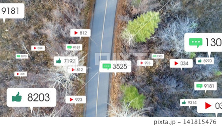 Running narrow road with yellow line through sparse woods, showing floating social-media labels Running narrow road with yellow line through sparse woods, showing floating social-media labels 141815476