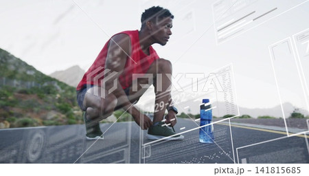 Tying shoe male runner on mountain road, wearing red top, tracker, blue bottle, digital overlays 141815685
