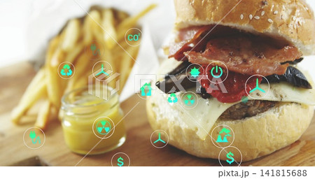 Sitting cheeseburger with melted cheese and bacon on wooden board, with fries, mustard, green icons Sitting cheeseburger with melted cheese and bacon on wooden board, with fries, mustard, green icons 141815688