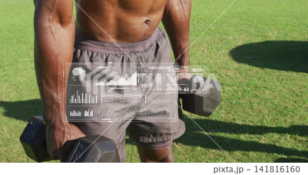 Posing fit man wearing gray drawstring shorts holding heavy hex weights on sunlit lawn, HUD overlay Posing fit man wearing gray drawstring shorts holding heavy hex weights on sunlit lawn, HUD overlay 141816160