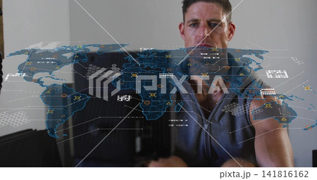 Studying man leaning to hologram map and interacting at home, wearing gray sleeveless zip-up top Studying man leaning to hologram map and interacting at home, wearing gray sleeveless zip-up top 141816162
