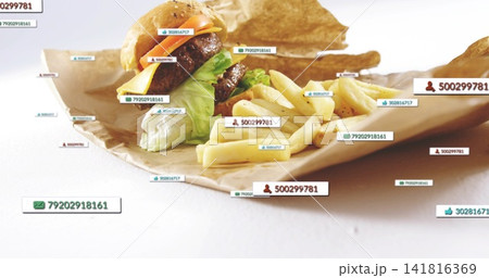 Displaying double-patty burger and fries on white tabletop over brown paper, with digital tags Displaying double-patty burger and fries on white tabletop over brown paper, with digital tags 141816369