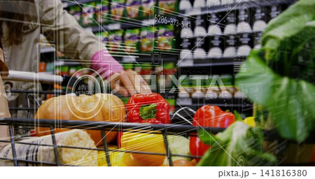 Grasping red bell pepper, beige-coat shopper reaching grocery aisle with wire cart, lettuce, HUD 141816380