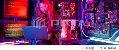 Asian woman is sitting at a desk with a laptop service in server room, Thinking and solve problems, Software engineer typing coding in laptop computer at data center Asian woman is sitting at a desk with a laptop service in server room, Thinking and solve problems, Software engineer typing coding in laptop computer at data center 141816838