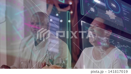 Smiling mature couple wearing smart casual sharing meal at restaurant with wine, HUD overlays Smiling mature couple wearing smart casual sharing meal at restaurant with wine, HUD overlays 141817019