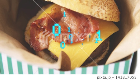 Displaying bacon cheeseburger sitting in paper-lined striped takeout box, with cyan binary overlay Displaying bacon cheeseburger sitting in paper-lined striped takeout box, with cyan binary overlay 141817055