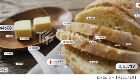 Showing rustic sliced loaf on wood table in kitchen, with butter pats, plate, linen, labels, cursor Showing rustic sliced loaf on wood table in kitchen, with butter pats, plate, linen, labels, cursor 141817101