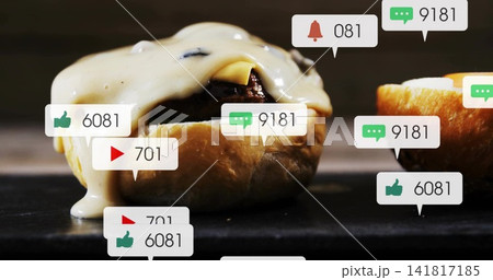 Showcasing glazed bun with dark filling dripping creamy sauce on slate board, with reaction bubbles Showcasing glazed bun with dark filling dripping creamy sauce on slate board, with reaction bubbles 141817185