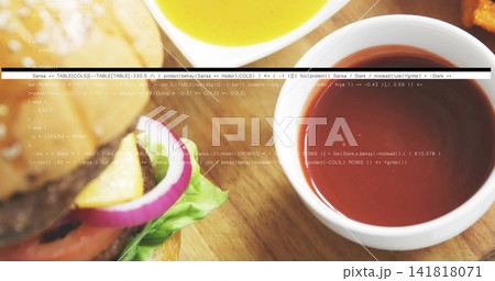 Framing white ceramic bowl holding red sauce on wooden board, with sesame burger, fries, copy space Framing white ceramic bowl holding red sauce on wooden board, with sesame burger, fries, copy space 141818071