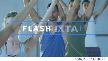 Stretching central male in blue tank raising arms overhead at fitness studio with barre, FLASH SALE 141818178