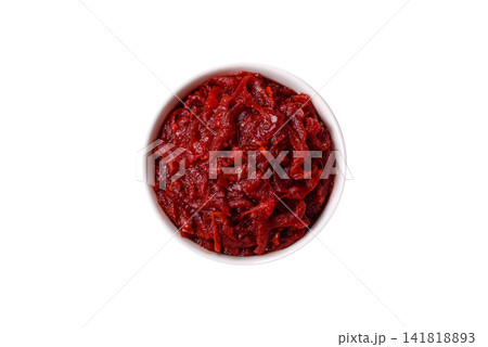 Grated beetroot with salt and spices as an ingredient for borscht or a vegan salad. Grated beetroot Grated beetroot with salt and spices as an ingredient for borscht or a vegan salad. Grated beetroot 141818893