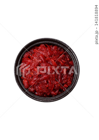 Grated beetroot with salt and spices as an ingredient for borscht or a vegan salad. Grated beetroot 141818894