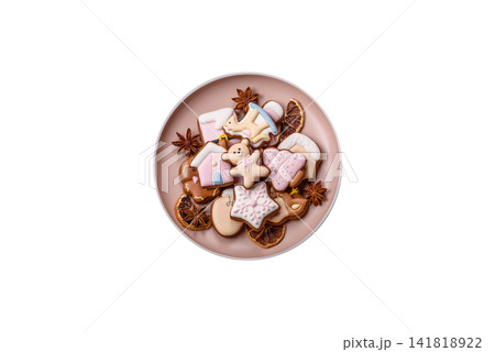 Gingerbread as a Christmas staple, sweet biscuits for the holiday. Gingerbread as a background Gingerbread as a Christmas staple, sweet biscuits for the holiday. Gingerbread as a background 141818922