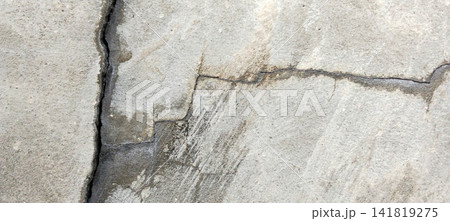 Deep cracks and water stains on the concrete surface texture. Deep cracks and water stains on the concrete surface texture. 141819275