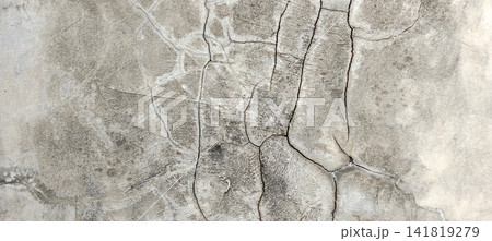 A network of fine cracks on a weathered concrete wall. A network of fine cracks on a weathered concrete wall. 141819279