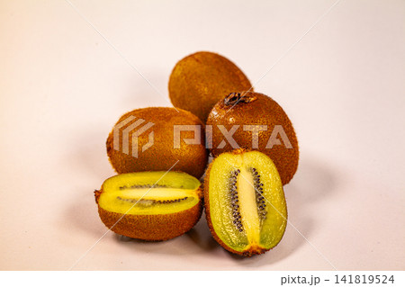 Fresh Golden Kiwi Fruit Isolated on White Background Fresh Golden Kiwi Fruit Isolated on White Background 141819524