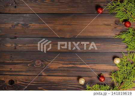 Festive winter holiday background with cypress branches Festive winter holiday background with cypress branches 141819619